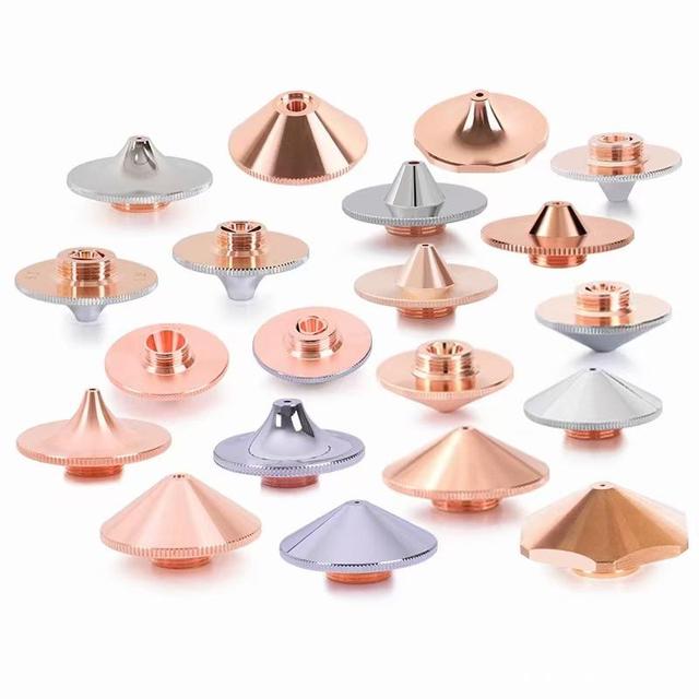 What is the function of the nozzle of the laser cutting head